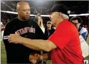  ?? AP PHOTO BY TONY AVELAR ?? Stanford coach David Shaw, left, and San Diego State coach Rocky Long shake hands at midfield after an NCAA college football game Friday, Aug. 31, in Stanford, Calif. Stanford won 31-10.