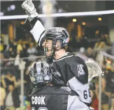  ?? ?? Calgary Roughnecks forward Tyler Pace celebrates with Tanner Cook during their game against the Panther City Lacrosse Club on Westjet Field at Scotiabank Saddledome on Saturday. Pace had three goals.