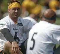  ?? Associated Press ?? Quarterbac­k Devlin Hodges ( 6) talks with teammate Josh Dobbs during a practice Saturday at Saint Vincent College.