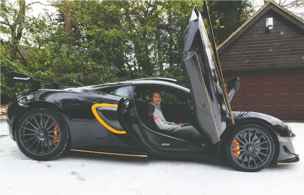  ?? NICK CAREY / REUTERS ?? Steve Glynn, who has owned a number of Mclarens and says he is willing to try out electric models when they become available, sits in his
most recently acquired Mclaren at his home in the village of Headley Down in southern england.