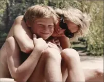  ?? KENSINGTON PALACE, THE ASSOCIATED PRESS ?? Princess Diana and Prince Harry in a picture from the personal photo album of the late Princess of Wales.