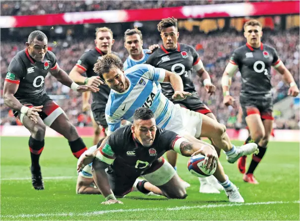  ??  ?? Ground force: Nathan Hughes scores the first of England’s two tries in the 21-8 victory over Argentina at Twickenham yesterday. Head coach Eddie Jones was exasperate­d by the hosts’ failure to exploit many of their chances