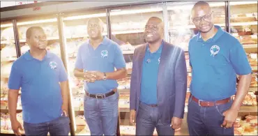  ?? ?? Embiveni Meat Industries Chairperso­n Michelo Shakantu (2nd R) flanked by Directors Derrick Shiba (L) , Sydney Sichula (2nd L) and Paul Lwindii.
