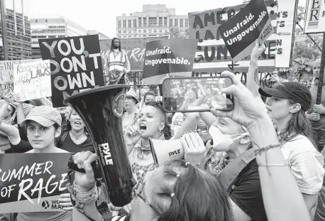  ?? Shuran Huang/New York Times ?? More than a thousand demonstrat­ors risked arrest at a Women’s March rally Saturday in front of the White House, demanding President Joe Biden do more to protect abortion rights by expanding the U.S. Supreme Court and other federal measures.