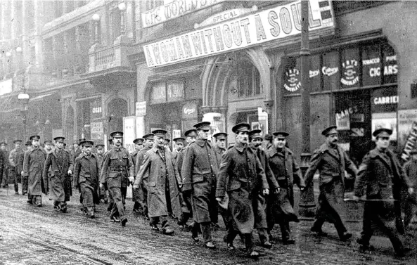  ??  ?? First World War soldiers marching past a cinema (top), places that provided escapism from the horror of battle