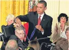  ??  ?? President Barack Obama presents the Medal of Freedom to Stephen Hawking in 2009.