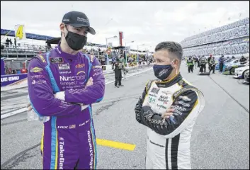  ?? John Raoux The Associated Press ?? AJ Allmending­er, right, will run his first Cup race since the 2018 season finale in Kaulig Racing’s entry Sunday at the O’Reilly Auto Parts 253 on Daytona’s road course.