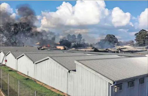  ??  ?? Smoulderin­g: Part of Glencoe prison was gutted in a fire in 2015 and, despite money having been earmarked for renovation­s, little reconstruc­tion has occurred. Now wardens are objecting to returning there, citing safety concerns. Photo: Northern KZN...