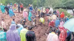  ??  ?? DEVASTATIO­N: Rescue workers rescue villagers in Ban Huay Khab in Nan’s Bo Klue district hit by a mudslide yesterday morning. Four houses were buried under the mud.