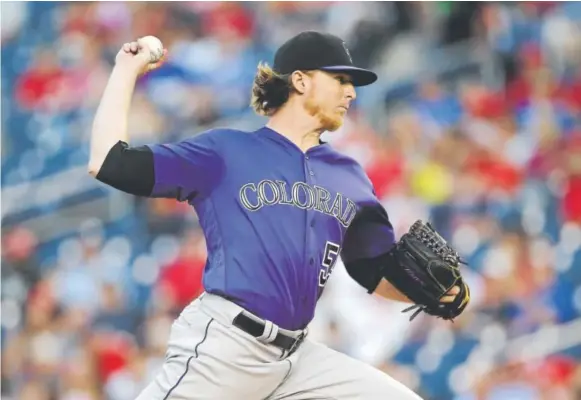  ?? Mark Tenally, The Associated Press ?? Right-hander Jon Gray, pitching Sunday night in Washington, dropped to 3-2 when the Rockies lost 3-1 and split a doublehead­er against the Nationals. Gray posted eight strikeouts and issued only one walk in seven innings, but two of the four hits he...
