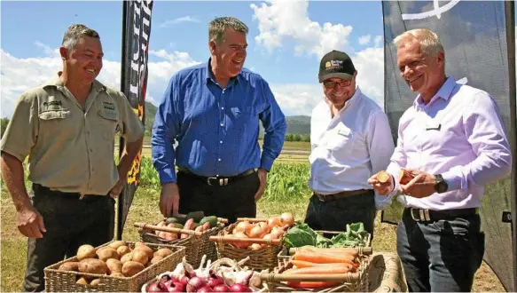  ?? Photo: Alexia Austin ?? FRESH: Celebratin­g the start of the Woolworths’ organic growth fund at a Lockyer property are (from left) property owner Anthony Bauer, Agricultur­e Minister Mark Furner, Heritage Bank CEO Peter Lock and Woolworths’ head of produce Paul Turner.