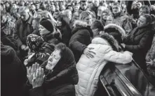  ?? Bernat Armangue / Associated Press ?? A funeral is held Tuesday in Lviv for four of the Ukrainian service members killed in a Russian missile strike on a military base in Yavoriv.