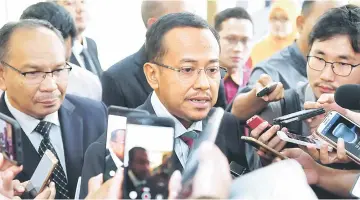  ??  ?? Ahmad Samsuri answers questions from the media after the National Finance Council 2018 meeting. — Bernama photo