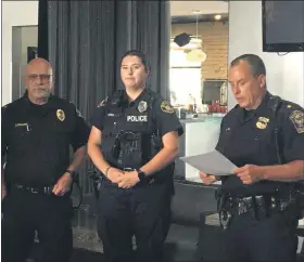  ?? MARAH MORRISON — THE NEWS-HERALD ?? Chief Larry Reik, of the Eastlake Police Department, reads off one of the two awardwinni­ng citations that were presented to area officers.