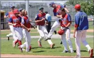  ?? NEWS PHOTO RYAN MCCRACKEN ?? Jack Suhai leaps onto Medicine Hat Moose Monarchs teammate Cavan Kolody in celebratio­n of Kolody's mercy rule walk-off single in the sixth inning of Sunday's AA American Legion Baseball game against the Missoula Mavericks at Jeffries Field.