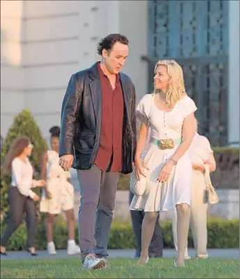  ?? François Duhamel Roadside Attraction­s ?? JOHN CUSACK is featured in “Love & Mercy” with Elizabeth Banks. In the film arriving Friday, Cusack shares the role of Brian Wilson with Paul Dano, who portrays the music titan at his creative peak.