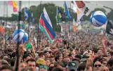  ??  ?? Music fans throng the venue for the Glastonbur­y Festival of Music and Performing Arts in Somerset, England.