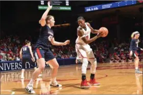  ?? ERIK SCHELKUN — COURTESY DAYTON ATHLETICS ?? Dayton redshirst senior Alex Harris (Lorain) looks to get around a Duquesne defender earlier this season. Harris and the Flyers are preparing for an NCAA Division I first-round game on March 16 against Marquette.