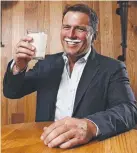  ??  ?? BOTTOMS UP: Today’s Karl Stefanovic enjoys a glass of milk. Picture: SAM RUTTYN