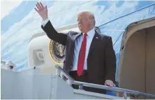  ?? AP FILE PHOTO ?? TAKING OFF: President Donald Trump waves from the door of Air Force One last month.