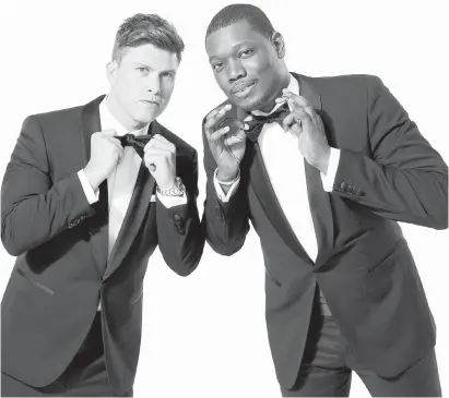 ??  ?? Saturday Night Live’s Colin Jost, left, and Michael Che will host the 70th Primetime Emmy Awards on Monday.