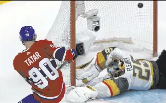  ?? Graham Hughes The Associated Press ?? Tomas Tatar, a former Golden Knights player, scores against Vegas goaltender Marc-Andre Fleury in the Canadiens’ 5-4 shootout victory Saturday in Montreal.