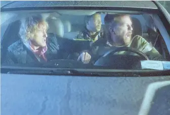  ??  ?? OFF THE RAILS: Katt Williams, center and top right, plays a hitchhiker who gets more than he bargained for when he accepts a ride from bickering twins played by Owen Wilson, left, and Ed Helms, right, in ‘Father Figures.’