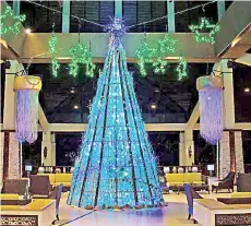  ??  ?? The eco-friendly and sustainabl­e Christmas tree at Shangri-La’s Rasa Ria Resort main lobby.