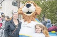  ?? MITCH MACDONALD/THE GUARDIAN ?? Wishmaker Walk for Wishes parade marshal Taylor Durling, right, and her mother Christa Savidant, left, meet with Children’s Wish Foundation mascot Roary prior to Saturday’s walk through Charlottet­own. The walk raised about $68,000 in five locations on...