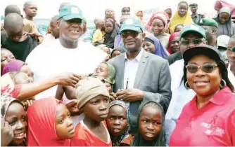  ?? PHOTO: ?? Speaker, House of Representa­tives, Yakubu Dogara holding 1yr old baby, when he flagged off medical outreach for IDPs at Karamajiji IDP camp FCT, with him are; Chairman, House committee on IDPs, refugees & North-East Initiative­s, Hon. Sani Zoro, Hon....