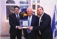  ?? (Yossi Zamir) ?? US AMBASSADOR to Israel David Friedman (center) and Director of Israel Philatelic Service Elhanan Shapira (right) unveil special edition US-Israel bond stamps at FOZ ceremony.