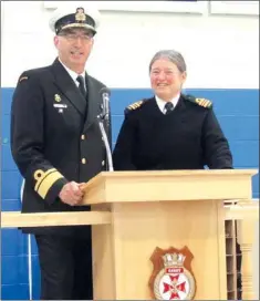  ?? — Photo by Josh Pennell/The Telegram ?? Rear Admiral John Newton commends Lt.-Cmdr. Margaret Morris for a career of service at an open house Saturday. After 42 years in the Canadian Armed Forces, Morris is retiring.