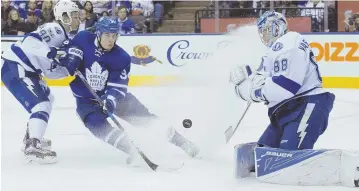  ?? ap photo ?? HELPING OUT: Tampa Bay goalie Andrei Vasilevski­y makes a save on Toronto’s Auston Matthews during the Lightning’s 4-1 victory last night, keeping the Leafs behind the Bruins in the race for Eastern Conference playoff positionin­g.