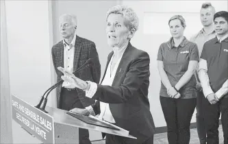  ?? CHRIS YOUNG THE CANADIAN PRESS ?? Ontario Liberal Leader Kathleen Wynne takes a question after making an announceme­nt at the Mothers Against Drunk Driving office in Toronto on Tuesday.