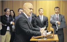 ?? ERALDO PERES / AP ?? Brazil’s justice minister, Alexandre de Moraes, discusses in Brasilia the arrest of 10 people who allegedly pledged allegiance to the Islamic State group on social media and talked about possible attacks during the Rio de Janeiro Olympics.