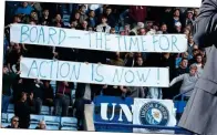  ?? ?? MAKING A POINT: Leicester fans unhappy with yesterday’s draw demand that the board should replace Brendan Rodgers (right) as manager