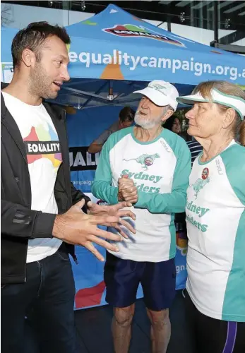  ?? PHOTO: AAP ?? MARRIAGE ADVOCATE: Swimming legend Ian Thorpe (left) talks to supporters of marriage equality in Sydney yesterday.