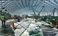  ?? FELINE LIM/ REUTERS ?? Constructi­on work proceeds at Changi Airport in Singapore inApril.
