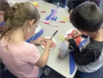  ?? Christina Cox/The Signal (See additional photos at signalscv.com) ?? (Above) Two students at Sunshine Day Camp at Valencia Valley Elementary School create arts and crafts that promote thoughts of kindness toward themselves and others. (Below) A student works on a project for Saugus High School Students Matter Club’s...