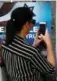  ??  ?? A woman takes a picture of a poster welcoming and supporting U.S. President Donald Trump in downtown Jerusalem on Friday