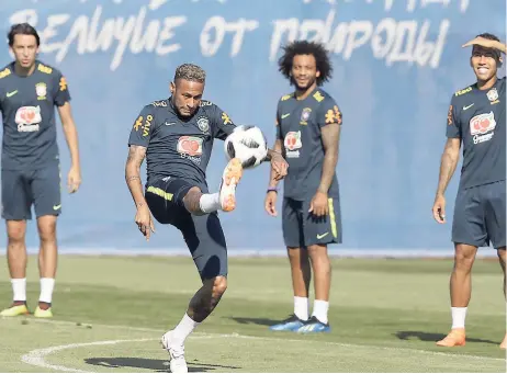  ??  ?? Brazil’s Neymar (second left) practises with teammates during a training session.