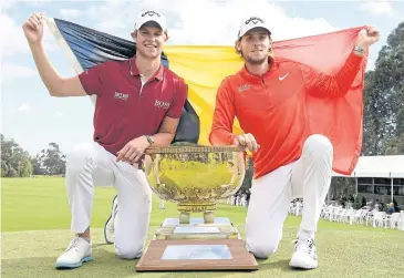  ?? AP ?? Belgium’s Thomas Detry, left, and Thomas Pieters pose with the trophy in Melbourne.