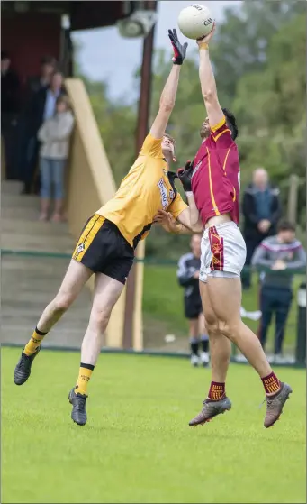  ?? Photo by Domnick Walsh ?? Duagh’s Anthony Maher (right) competes with Jack Keane, Asdee, for possession of the ball during their Junior Championsh­ip Round 2 match in Duagh.