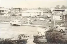  ?? Photo / Horowhenua Chronicle ?? Tornado damage, Newport and Cardiff streets, Levin, in 1969.