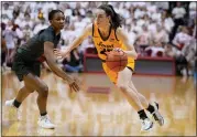  ?? THE ASSOCIATED PRESS ?? Iowa’s Caitlin Clark goes to the basket against Indiana’s Chloe Moore-McNeil on Thursday in Bloomingto­n, Ind.