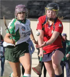  ??  ?? Maura O’Rourke of Kilrush under pressure from Amy Mitten.