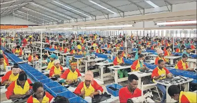  ?? AP PHOTO ?? In this Jan. 5 photo, Ethiopian factory workers make shoes at the Chinese company Huajian’s plant in Addis Ababa, Ethiopia.