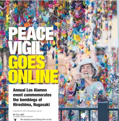  ?? EDDIE MOORE/JOURNAL ?? Maria Decsy, from Connecticu­t, hangs some of the 70,000 peace cranes during the remembranc­e of Hiroshima Day at Ashley Pond in Los Alamos in 2015. Around 250 people attended the event marking the 70th anniversar­y of a atomic bomb being dropped on the Japanese city.