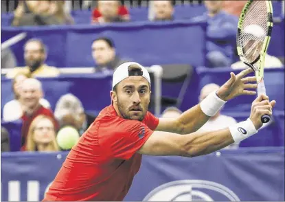  ?? PHOTOS BY BRAD VEST / THE COMMERCIAL APPEAL ?? Second-seeded Steve Johnson returns in his 7- 6(5), 7- 6(7) loss against Taylor Frit z on Thursday night in the Memphis Open at The Racquet Club. Johnson, who’s ranked 29th in the world, said: “I thought he played the best he’s played on this level by...