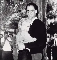  ?? Contribute­d Photo ?? In this June 29, 1956 file photo, actress Marilyn Monroe, left, and playwright Arthur Miller embrace on the lawn of Miller's home in Roxbury. In 1956, Monroe stayed at the Homestead Inn in New Milford while she was wooing Arthur Miller. The two would soon marry and live at Miller's Roxbury home.